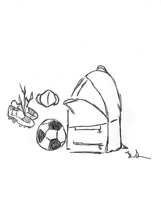 Open backpack with cleats, a soccer ball, and a mask showing the supplies needed to play soccer in the COVID-19 pandemic