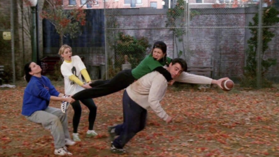 Rachel clings to Joey as he struggles to make a touchdown during the extremely competitive football game. (Season 3, Episode 9, “The One With the Football”) 
