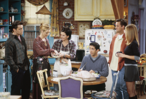 The friends gather in Monica’s kitchen Thanksgiving morning, helping her with the preparations of the turkey. (Season 4, Episode 8, “The One With Chandler in a Box”) 
