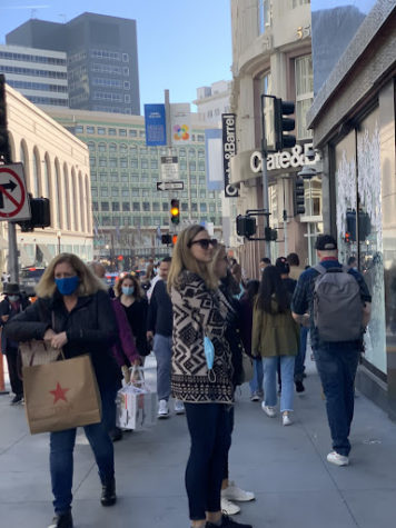 Union Square sidewalks are pictured full with pedestrians acquiring Black Friday purchases.