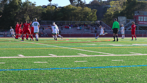 Senior striker Owen Benson takes a free kick from just outside the 18 yard box, which was saved by the goalie.