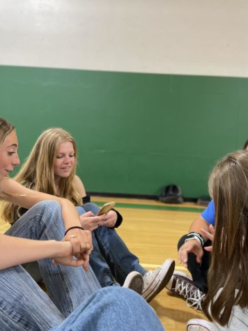 Girls enjoy time to socialize with their peers during 5th period PE class.