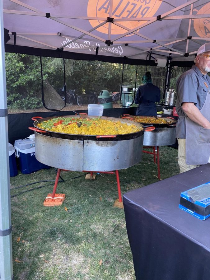 Gerard’s Paella serves paella cooked in large pots that market-goers can enjoy on the grass.