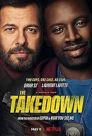 Ousmane Diakite (Omar Sy) and Francois Monge (Laurent Lafitte) pose as partners as they prepare to break their homicide case. 