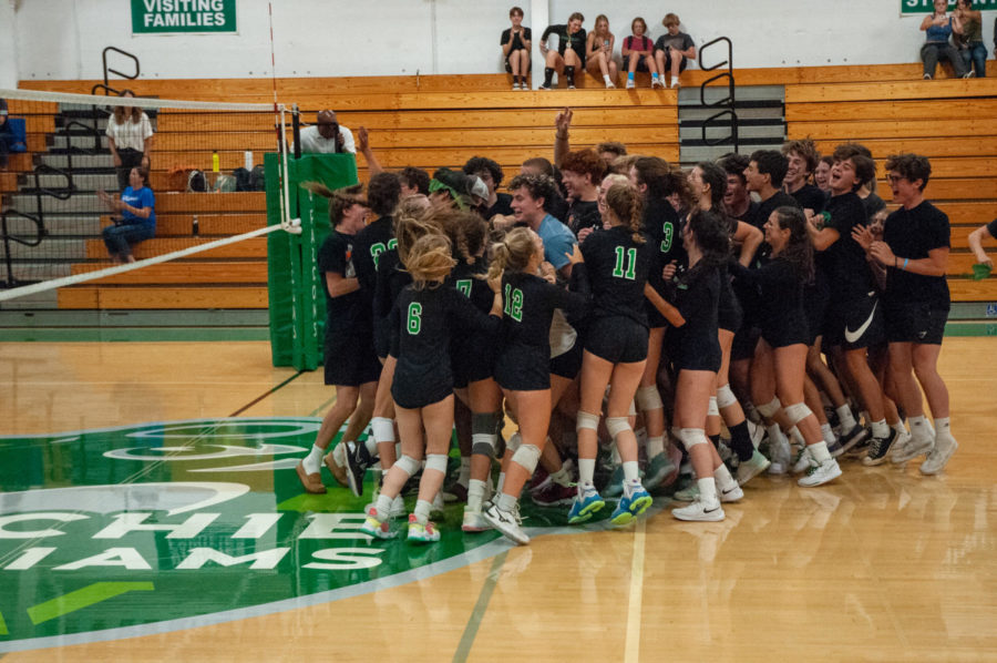 Students celebrate the Falcons girls varsity volleyball team after their four set win over Acalanes High School on Aug. 24.
