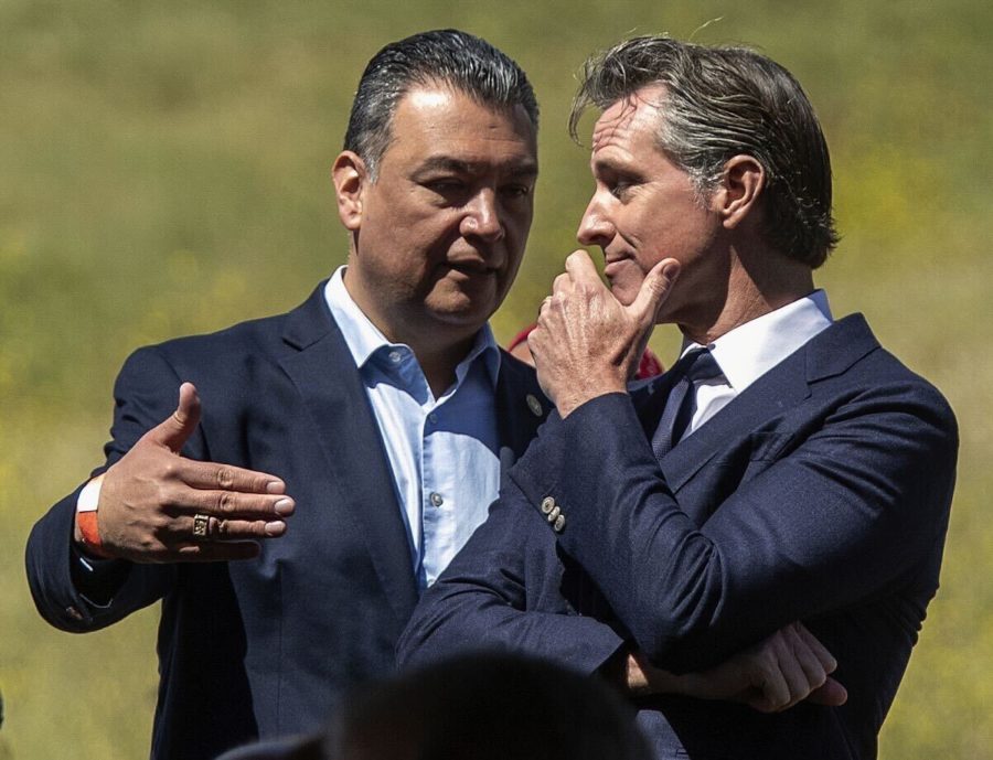 California senator Alex Padilla [D] speaks with California governor Gavin Newsom [D]. In the 2022 midterm election, both of these candidates won re-election.