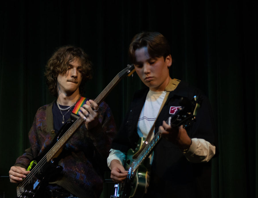 Gabe Wallis and Santiago Desruisseau play bass and guitar for their band “The Lovers.”