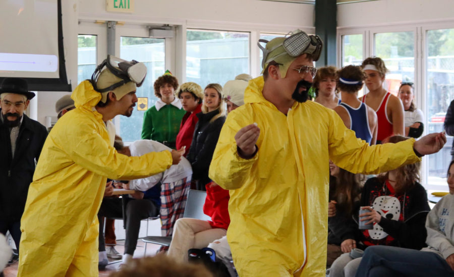 A herd of Walter Whites overtakes the runway as their audience treads lightly.