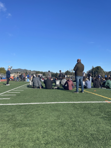 Faculty takes roll call on the Tamalpais High School football field to ensure all students are accounted for.