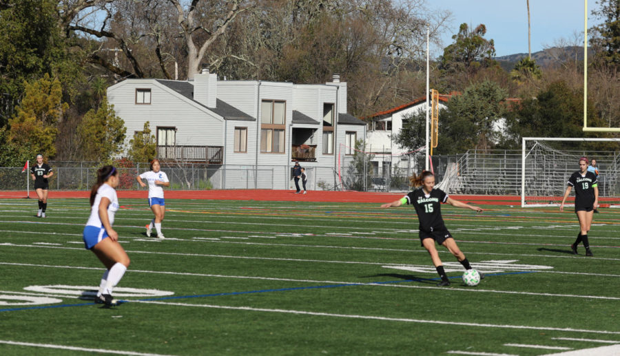 Senior Beth Brisson clears the ball during the first half of Saturdays game.
