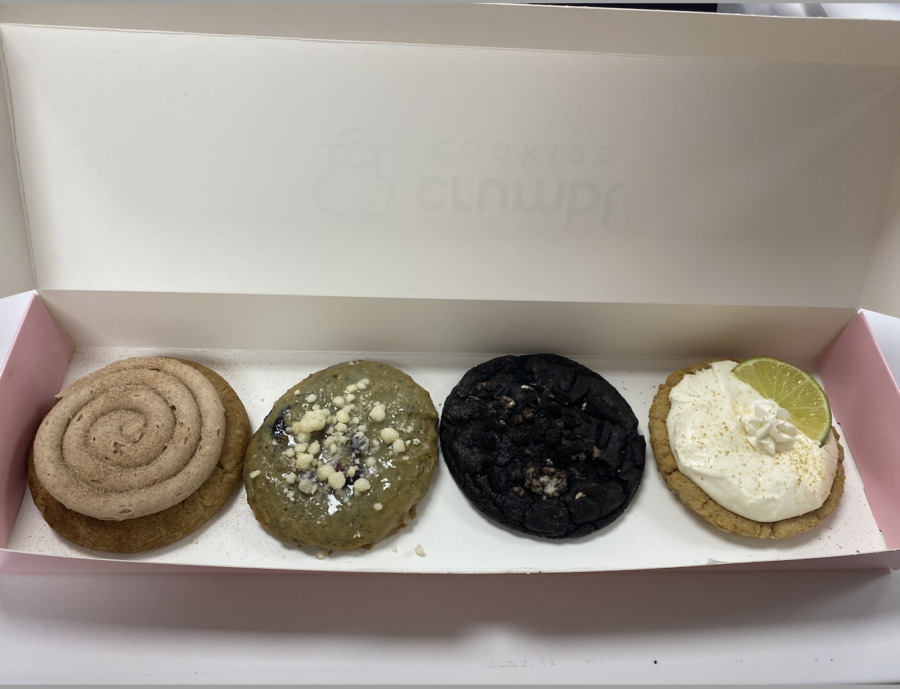 Crumbl cookie’s 2/06 lineup of Churro, Blueberry Muffin, Chocolate Cookies and Cream, and Key Lime Pie (left to right) colorfully fill up Crumbl’s signature pink box.