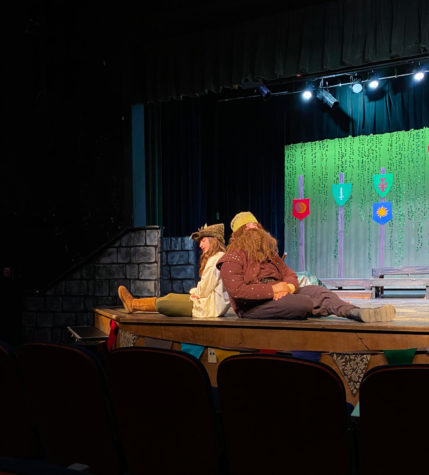 Beginning drama students Zara Prime and Cavan Donery take the stage during Marian, and sit back to back as their characters have an emotional moment.