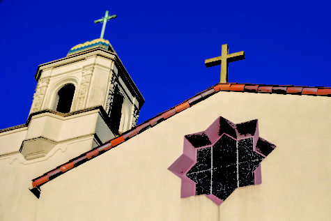 Across from the Fairfax library, the crosses atop the Saint Rita Church shine.