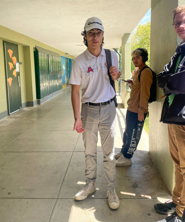 Senior Elinori Guidinger putters his way to his seventh period class during Tuesdays Happy Gilmore Day. 