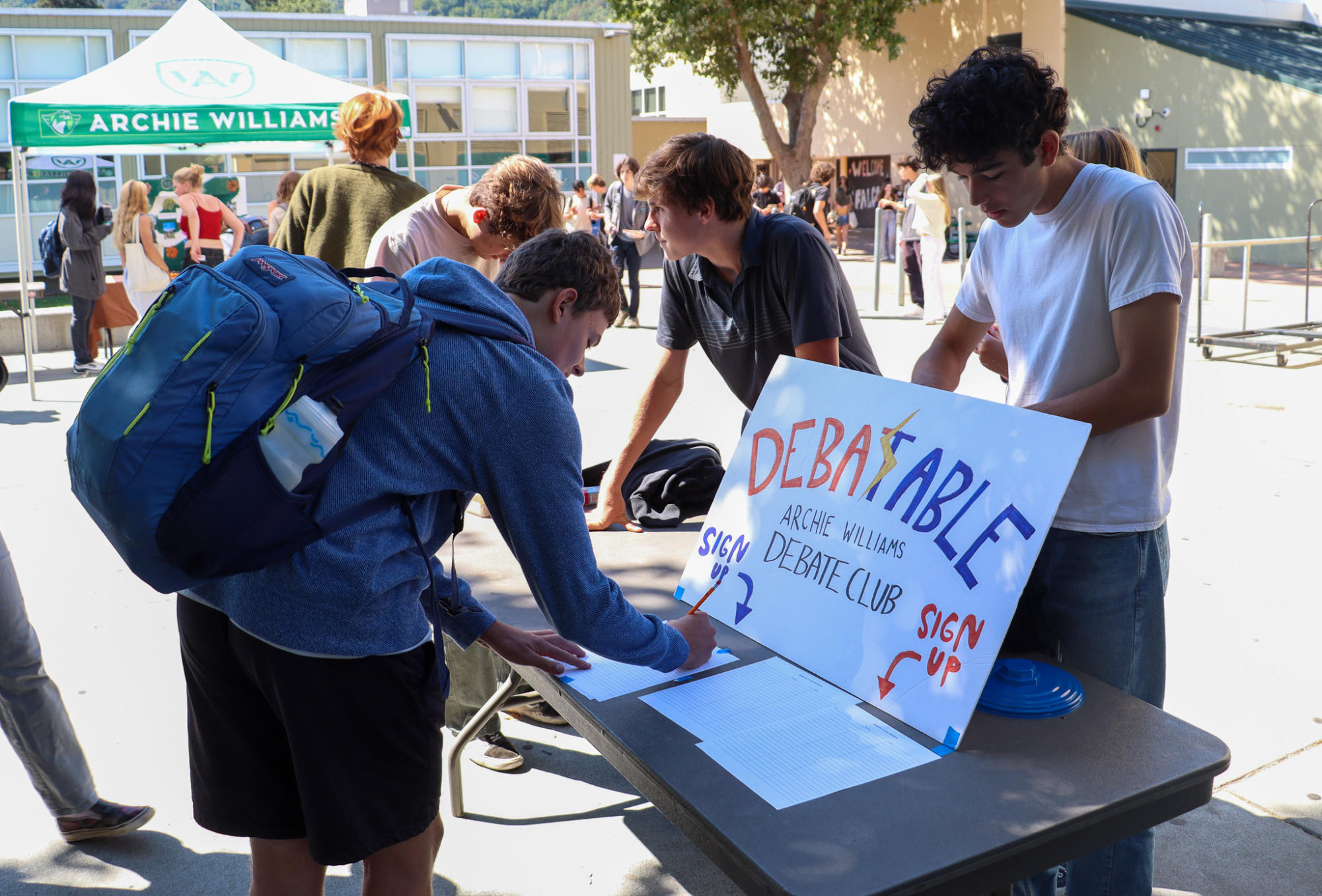 Juniors Noble Peter-Frank and Nolan Marsh aquire sign ups for Debate Club during club day.
