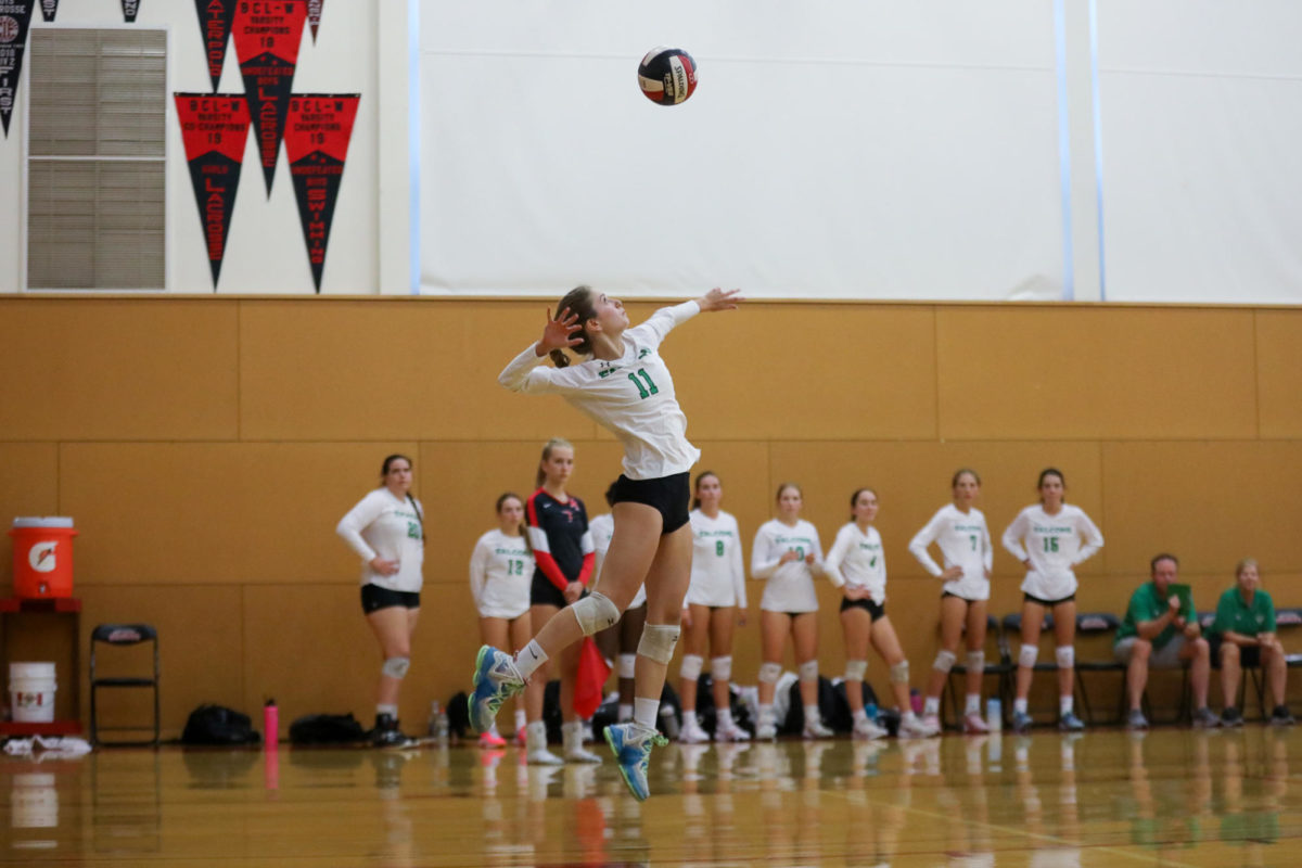 Senior Amelia Richer launches a serve during the second set against Marin Academy on Thursday. 
