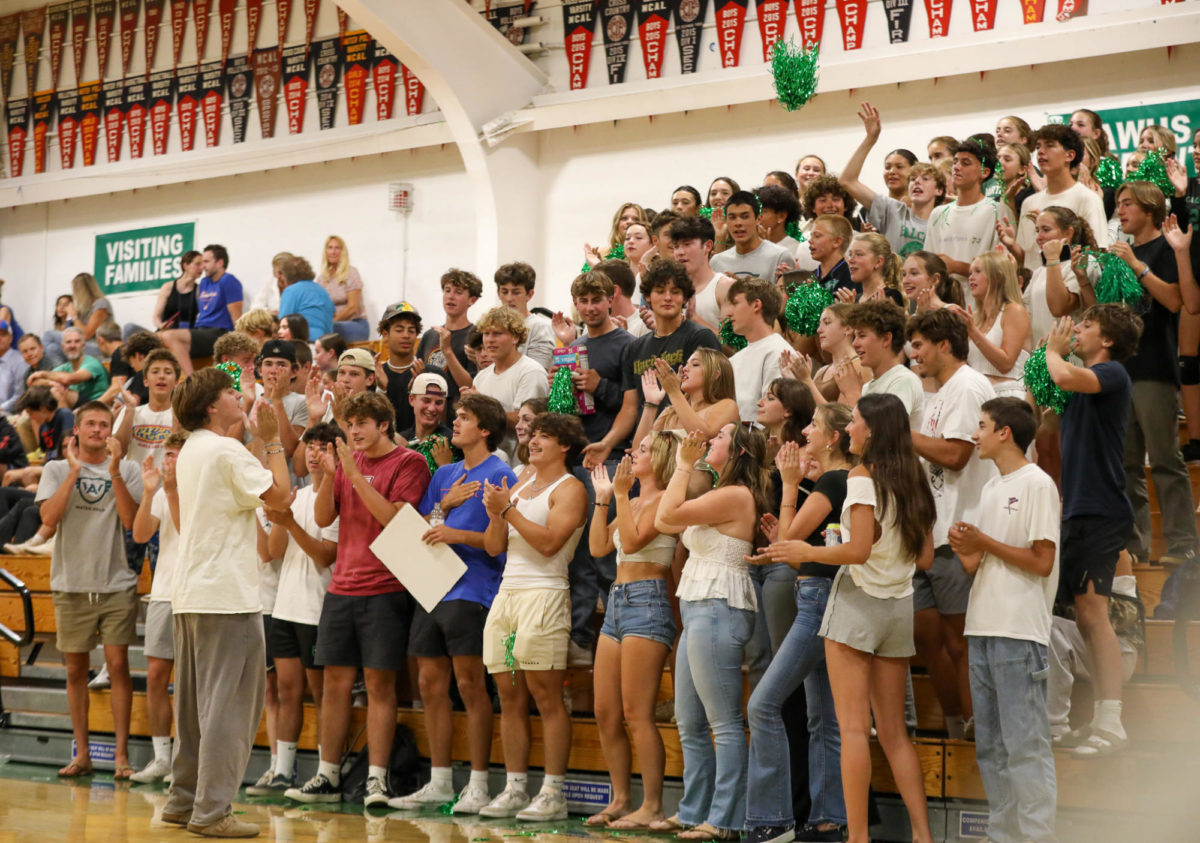 Archie Williams senior Brody Rhodes leads the student section through the Falcon chant. 