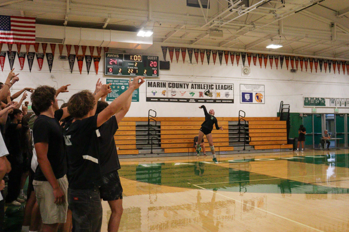 Student section helps Girls Varsity Volleyball soar to victory against Carondelet