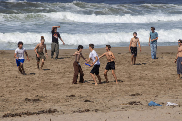 On Thursday afternoon at Kehoe Beach, SEA-DISC students play a game of ultimate frisbee.