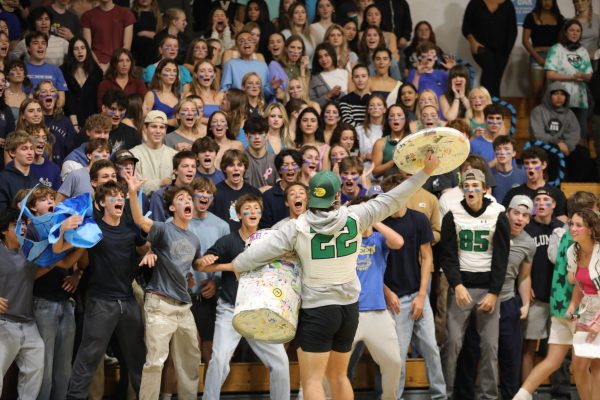 Archie Williams senior Kyle Fredrickson leads the juniors with the Spirit Can.