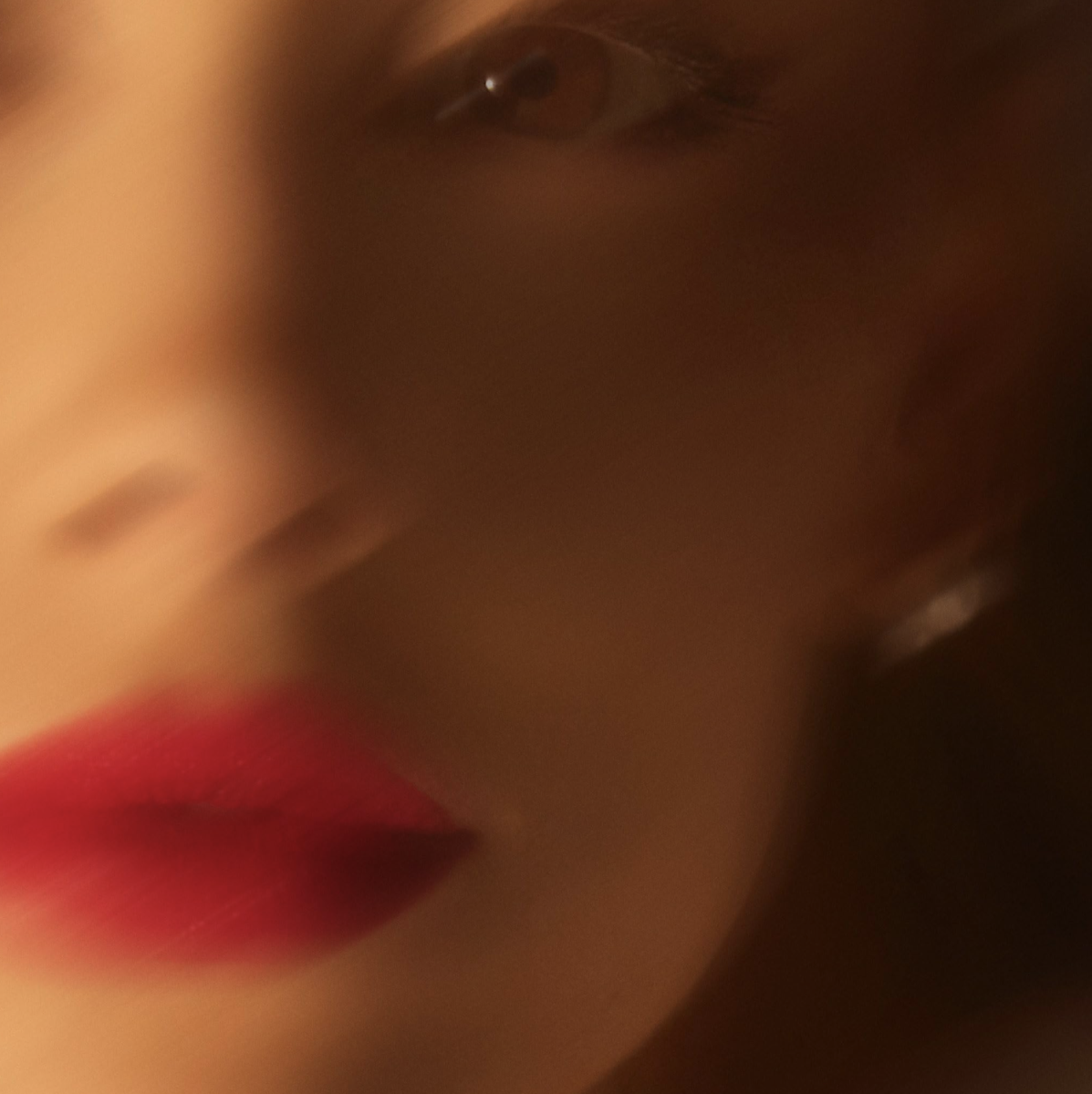 Ariana Grande poses up close to the camera in a blurry snapshot used as her new single’s cover.
Promotional material courtesy of Imbd