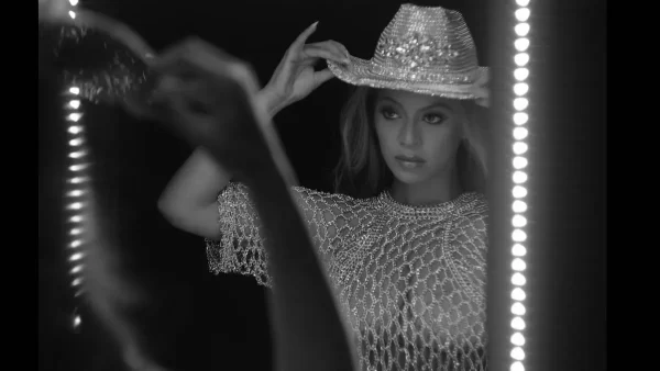 Beyoncé stays on a country theme while adjusting a cowboy hat in the newest lyrical visualizer for one of her new singles “16 Carriages.”
