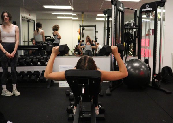 Hall Middle School eighth grader Imogene Gilmartin lifts weights at The Anchor Method.