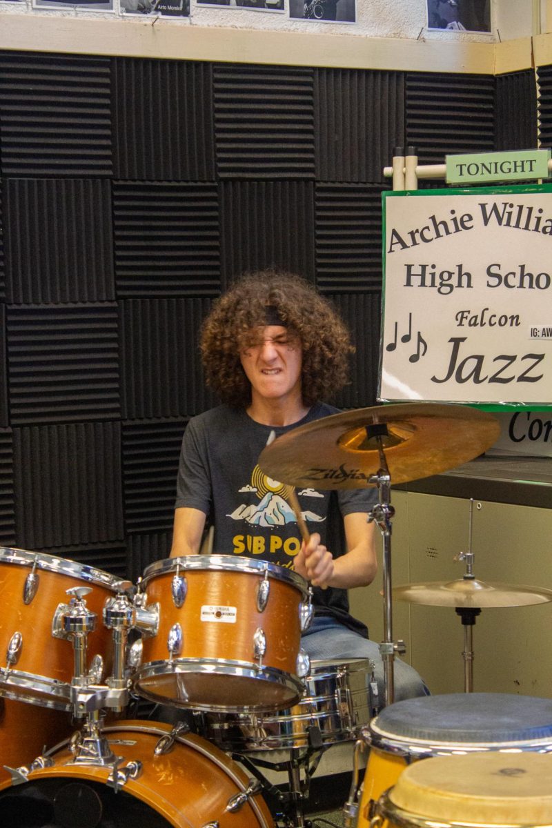 Ready for Geddy drummer Zeke Cunningham jams out in a music practice room.