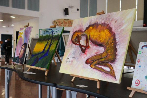 Student-made paintings on display during the third annual BIPOC Art Exhibit. 