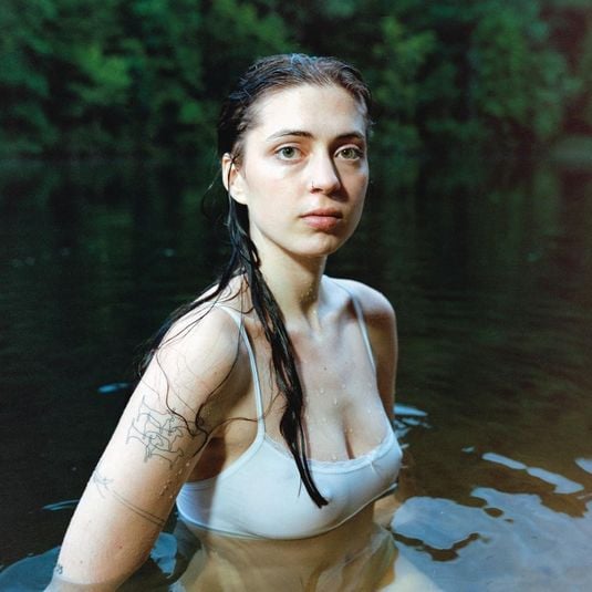 The cover of Older depicts McAlpine in a white bathing suit submerged in a lake.
Courtesy of RCA Records
