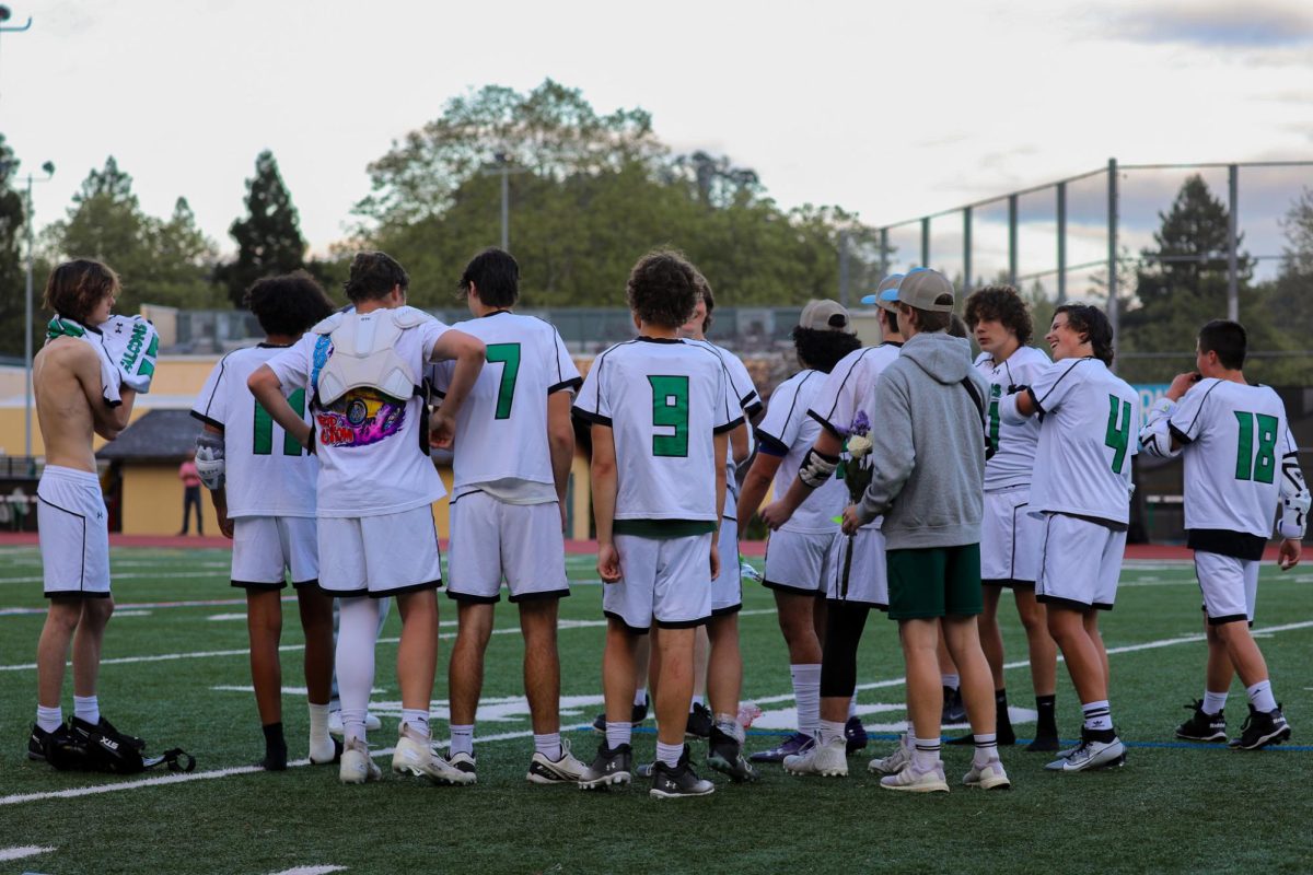 The+AWHS+boys+varsity+lacrosse+team+socializing+with+each+other+after+a+tough+loss+to+Lowell+High+School.