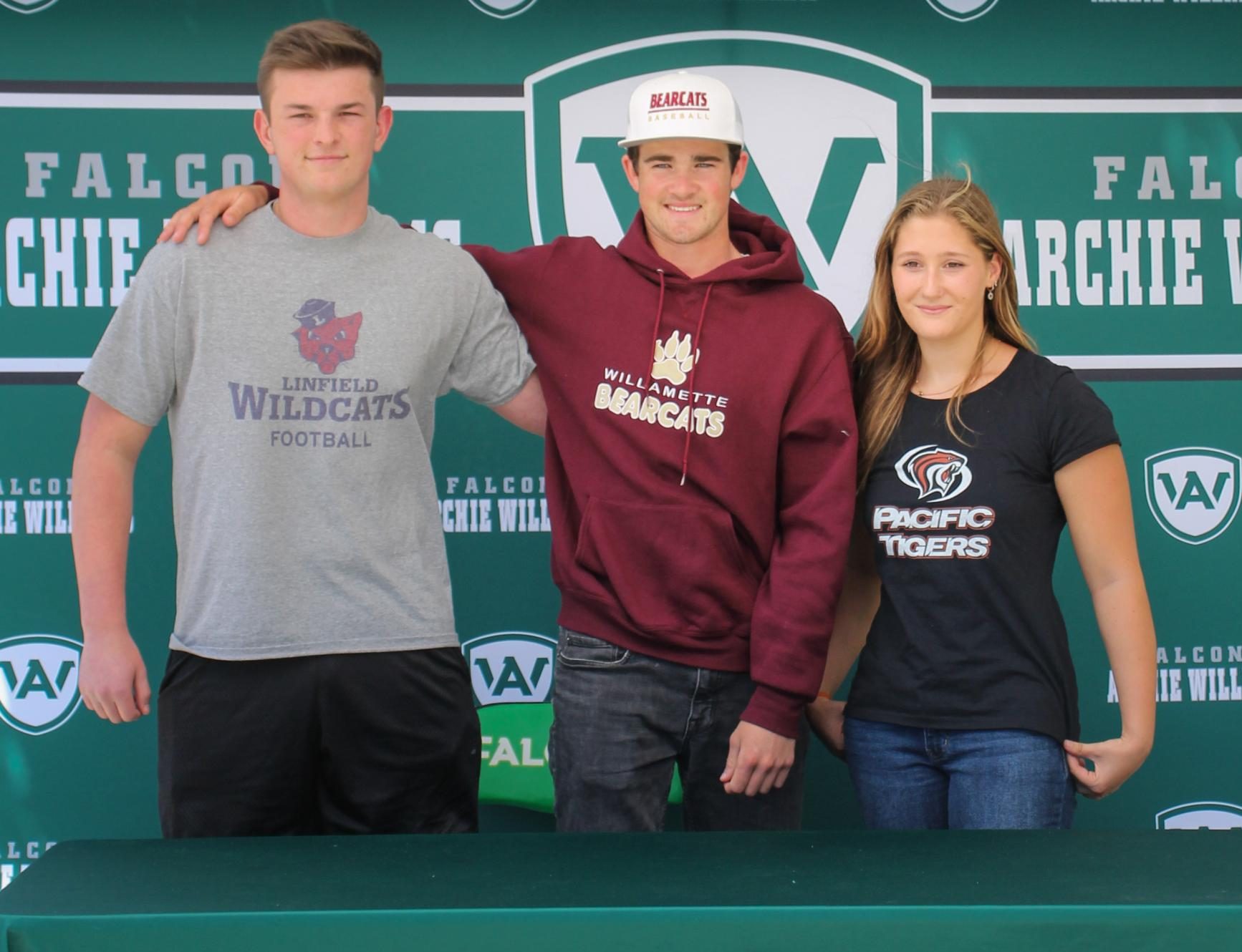 All three newly signed athletes pose together May 9 on signing day.