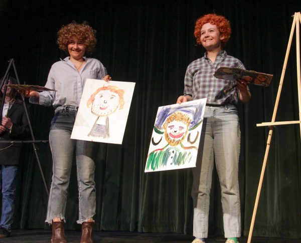 Archie Williams juniors Linnea Nowlen and Lilli Walker present their masterpieces after an improvised comedic sketch.