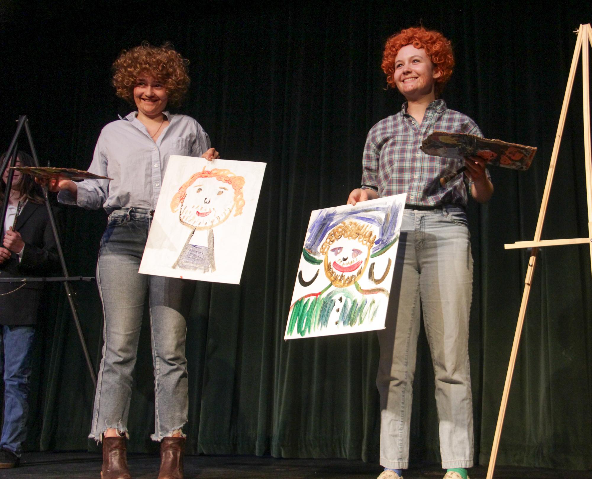 Archie Williams juniors Linnea Nowlen and Lilli Walker present their masterpieces after an improvised comedic sketch.