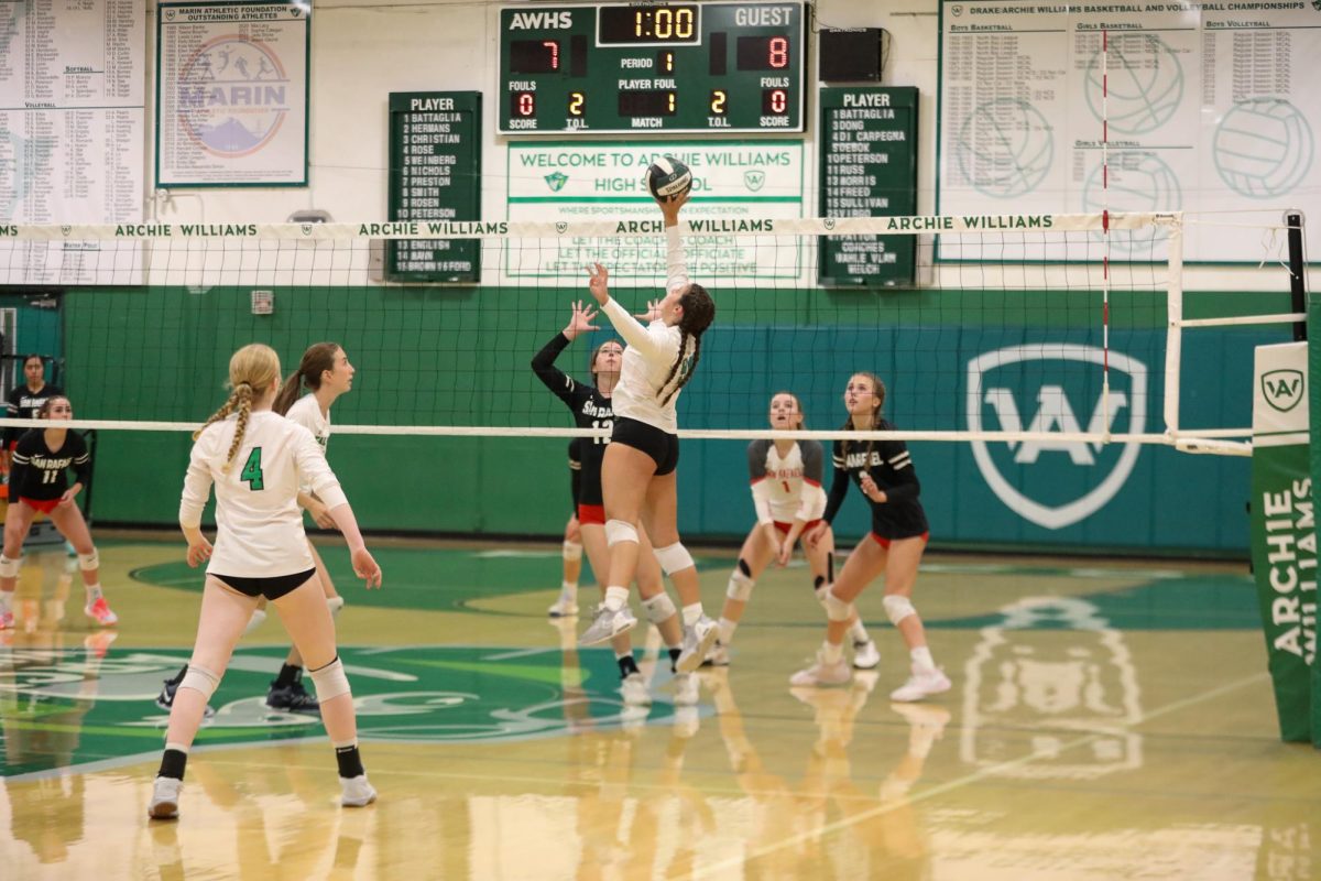 Archie Williams junior Alyse Rosen tips a ball over the net. 