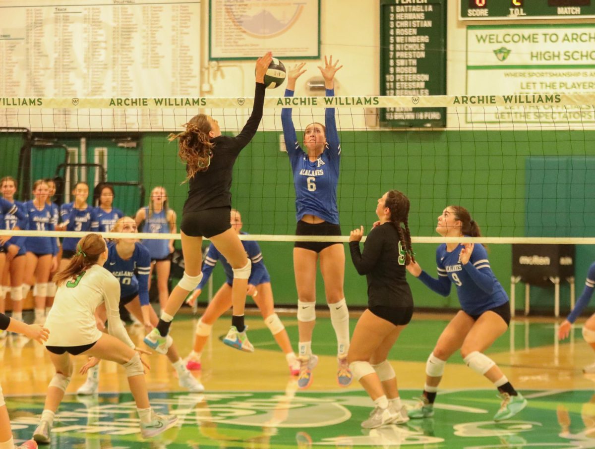 Archie Williams freshman Ada Nichols spikes a ball over the net. (Nola Miller)