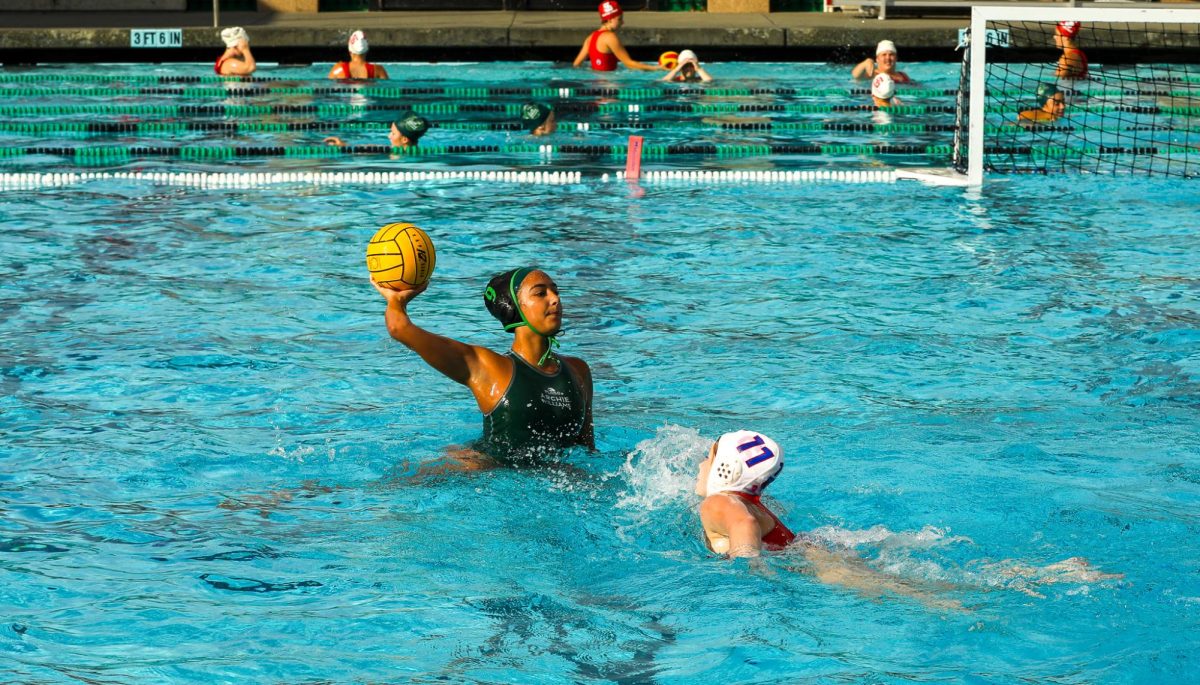 Archie Williams junior Nadya Wachelka looks to pass the ball off as a defender swims towards her. 