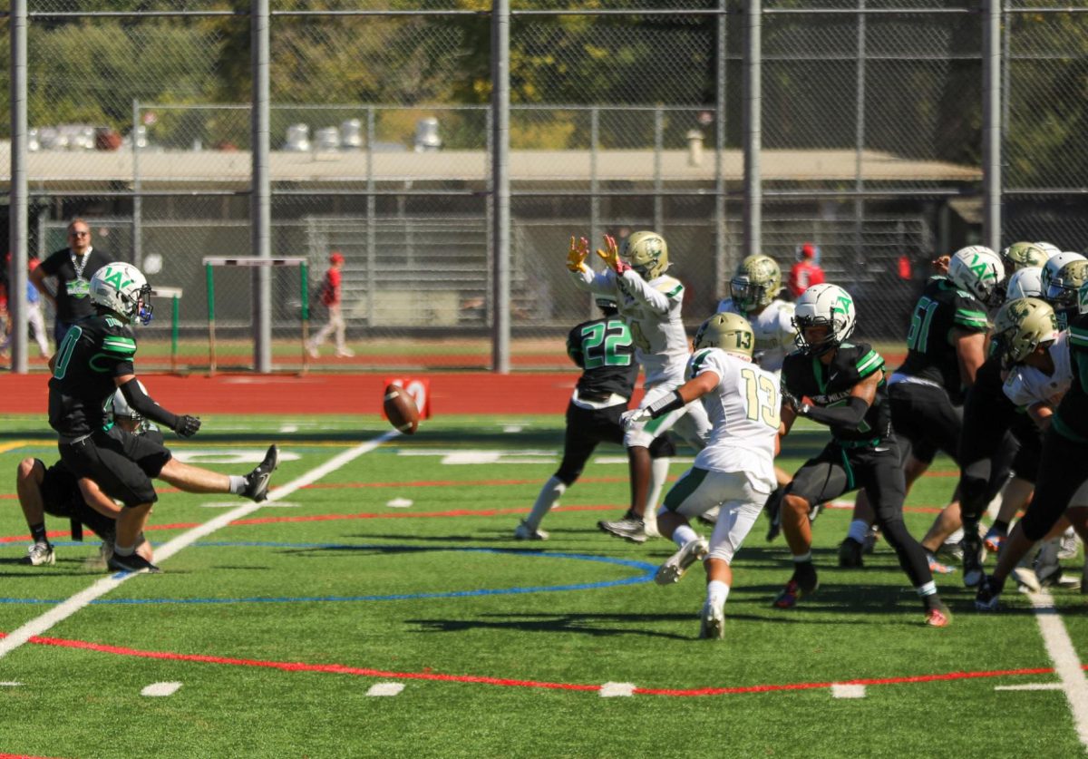 Archie Williams senior Arlo Maury kicks for an extra point after the Falcons' first touchdown.