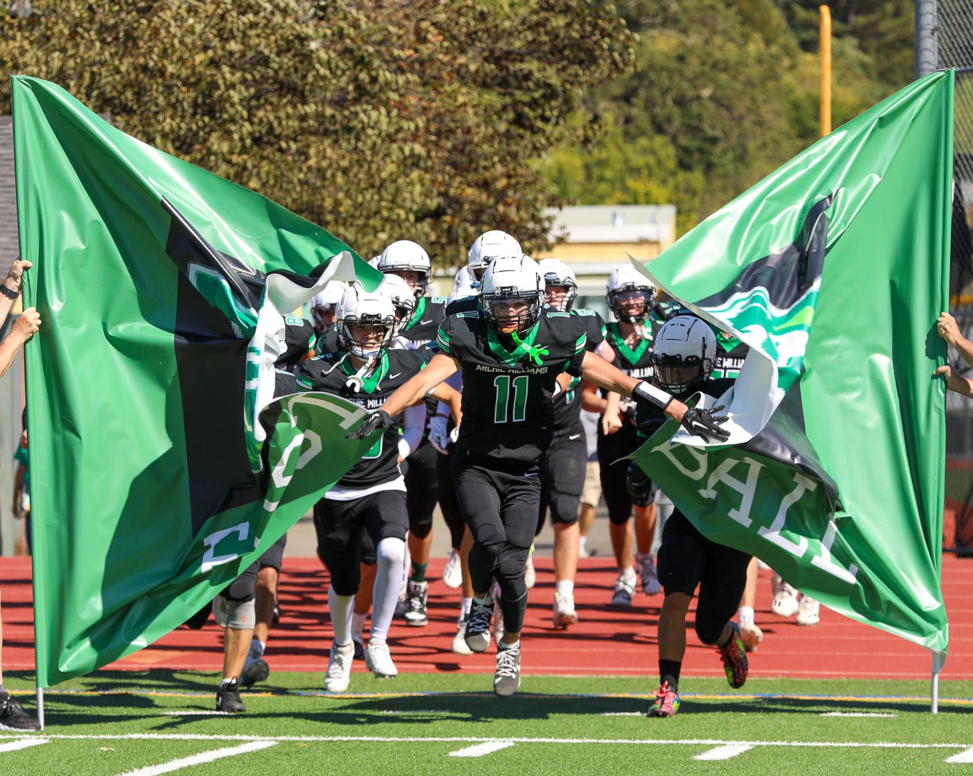 The Archie Williams Falcons storm the field after half time, looking for a victory against the Eagles. 