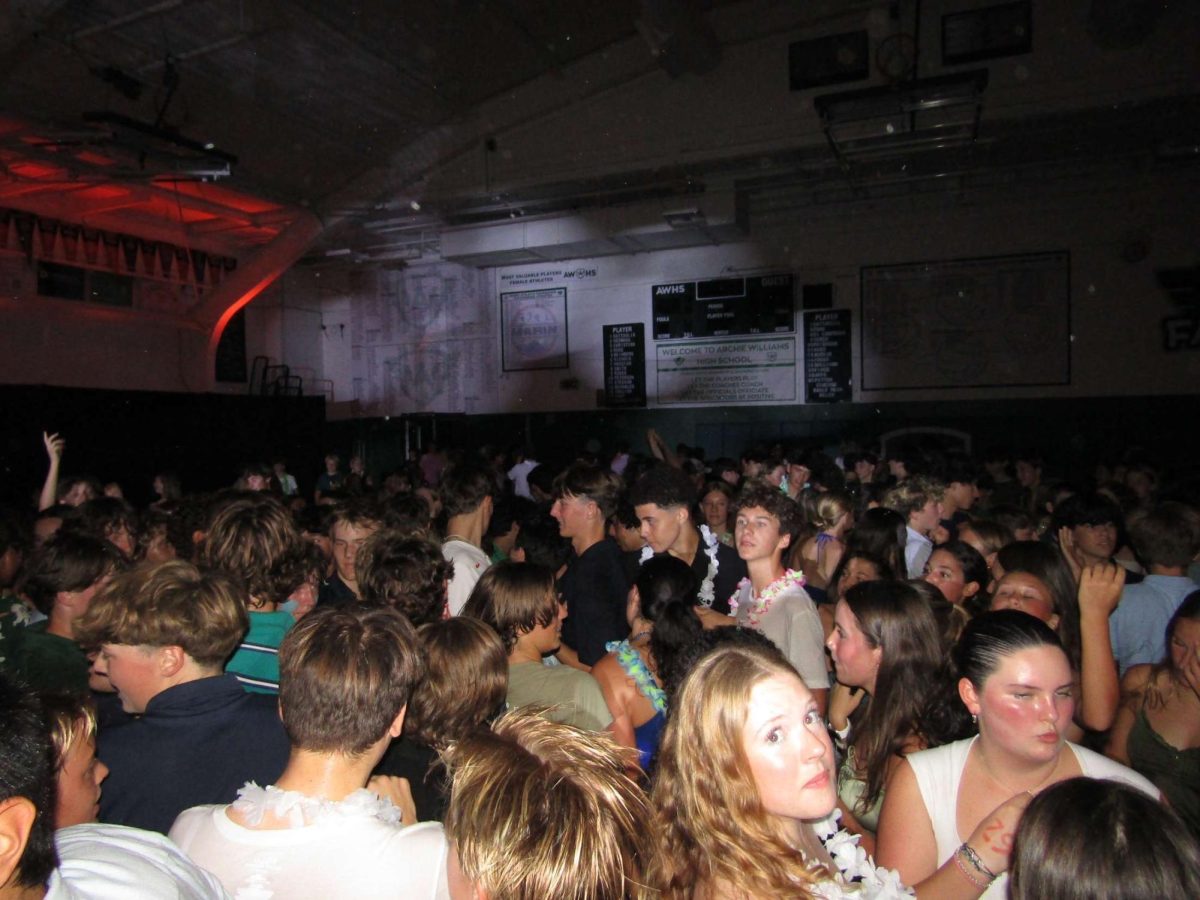 Archie Williams students gather in the main gym anticipating the next song during the Homecoming Dance.