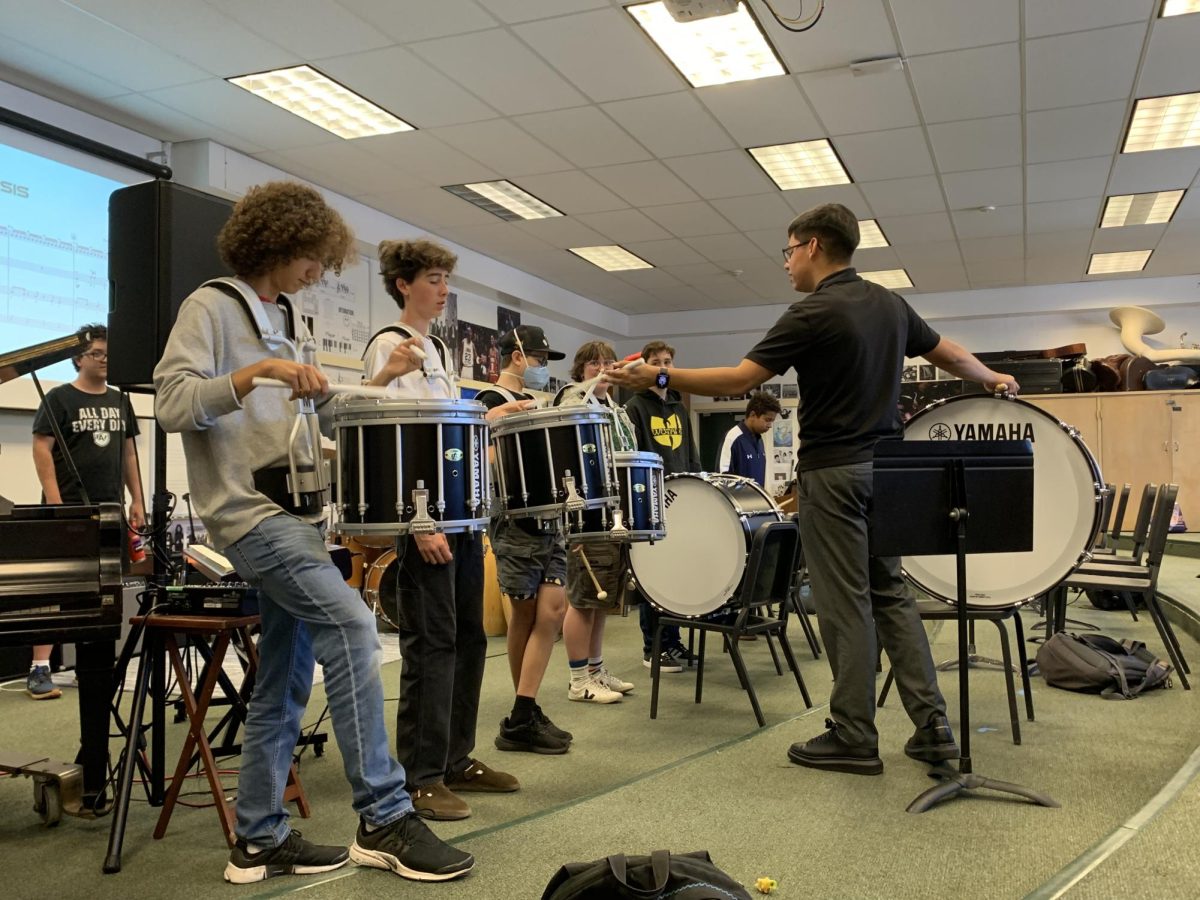 Music Teacher Mario Aparicio teaches the students in the Archie Williams drumline during a practice. (Courtesy of Mario Aparicio)