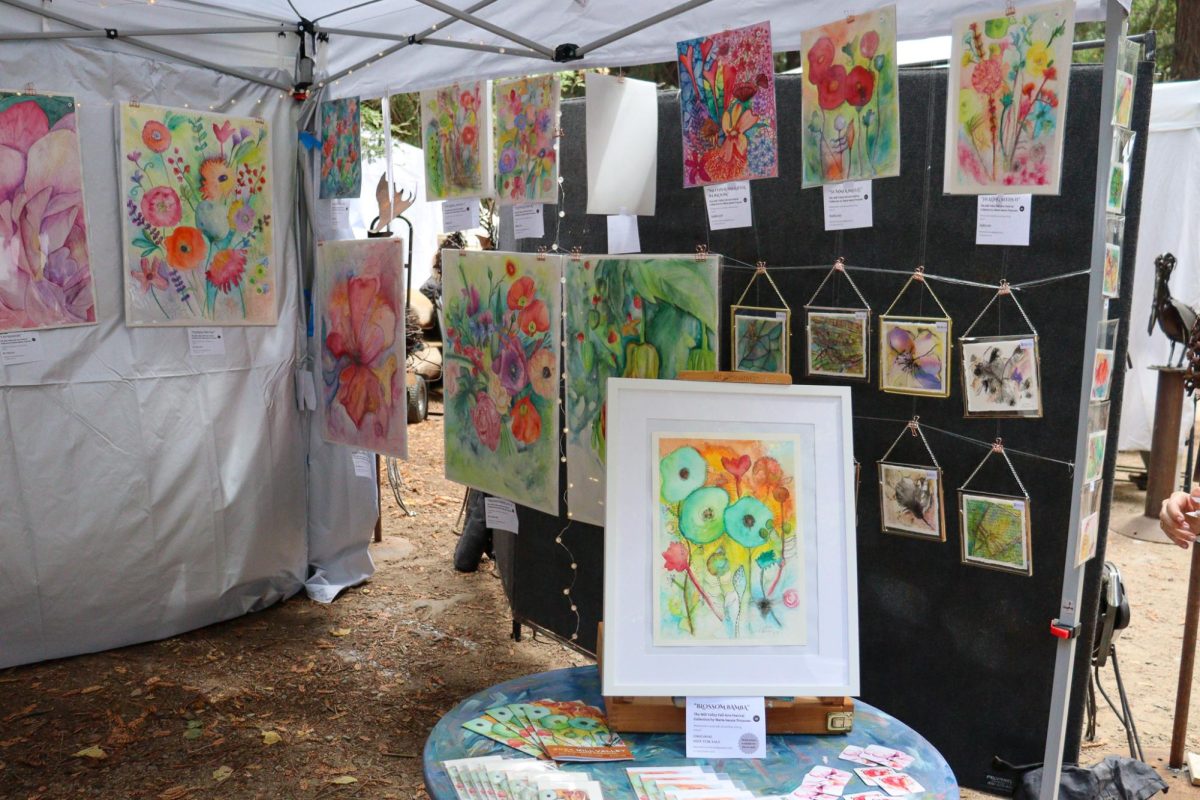 María Isaura Troncoso, the Mill Valley Fall Arts Festival Poster Artist winner, displays her work at a booth at the festival. 