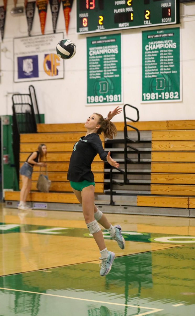 Archie Williams sophomore Danielle Christian serves the ball during the second set of the game against Marin Academy.