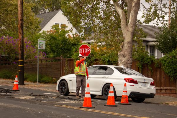 Construction workers control the flow of traffic through Sir Francis Drake Blvd Sept. 18.