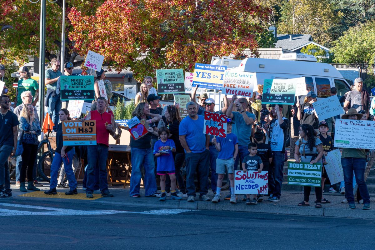 Fairfax community members hold up signs during the protest Oct. 23.