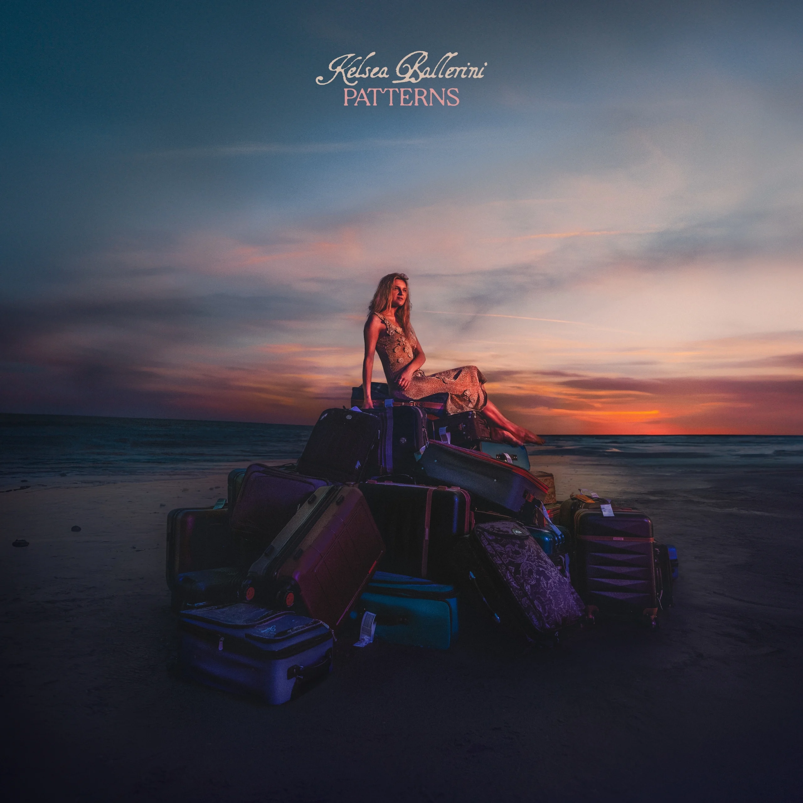 On the PATTERNS album cover, Ballerini rests on a pile of suitcases with a coastal background, symbolizing lyrics from her third track titled “Baggage.” (Promotional courtesy of Nyk Allen and Black River Entertainment)
