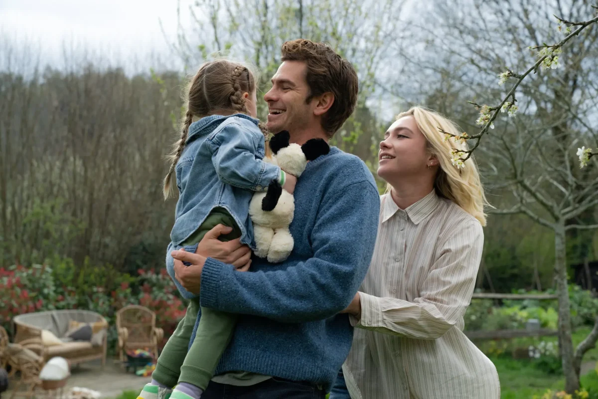 Ella (Grace Delaney), Tobias (Andrew Garfield), and Almut (Florence Pugh) spend time together as a family.