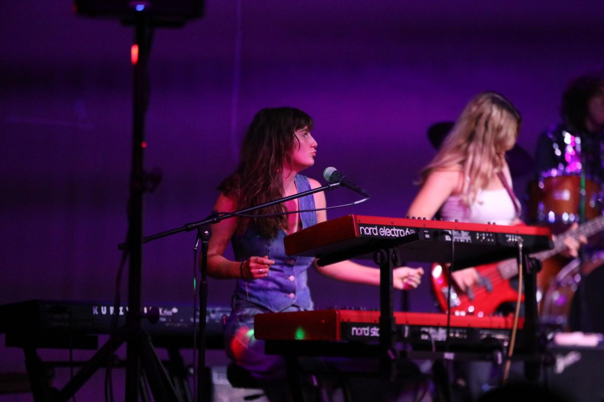 Archie Williams senior Stella Smoot plays keys while singing during a performance of Amy Winehouse's Valerie. 