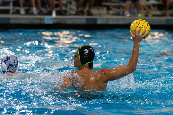 Boys water polo slams the Davis Blue Devils, defending their home pool