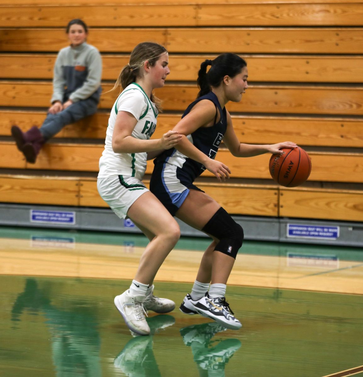 Freshman Isla Fisk plays tough defense against a Bay offender.